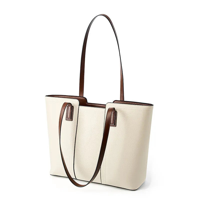 Women's black cowhide leather crossbody bag showing multiple internal compartments including phone pocket and file storage