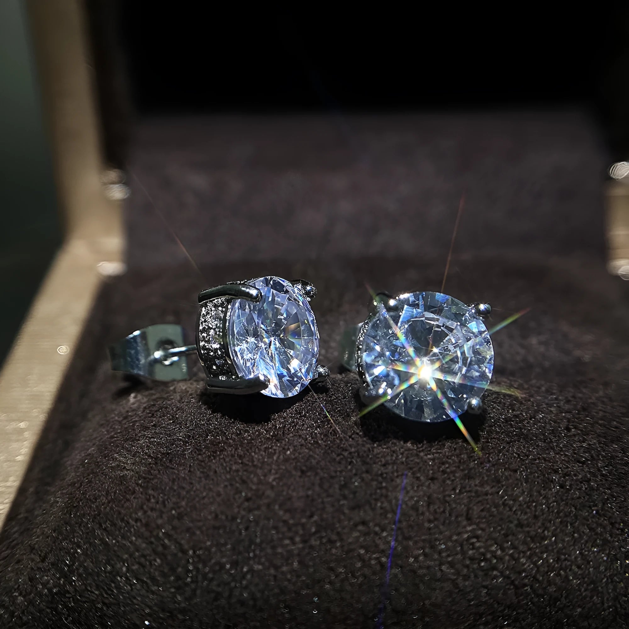 Women's round white zircon stud earrings with copper geometric round shape on display
