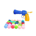 Plush ball-firing toy gun with a pile of soft yarn balls for interactive pet play