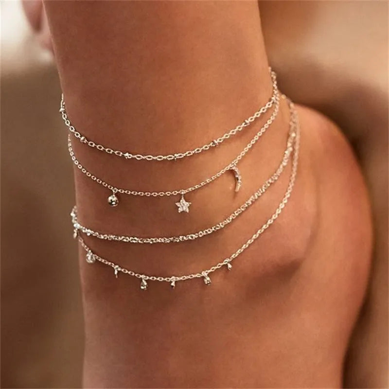 Alloy anklet with fruit-themed design and crystal inlay on a neutral background