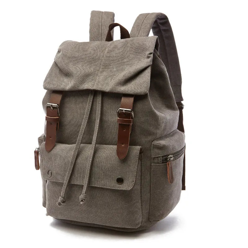 Canvas travel backpack in solid colour with sewing line details, capacity below 20L