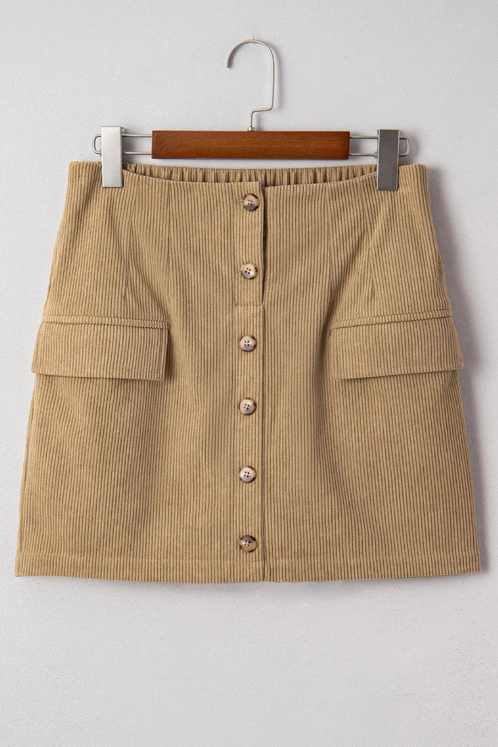 Women's corduroy hip skirt in coffee colour with button detail, short length, polyester fabric