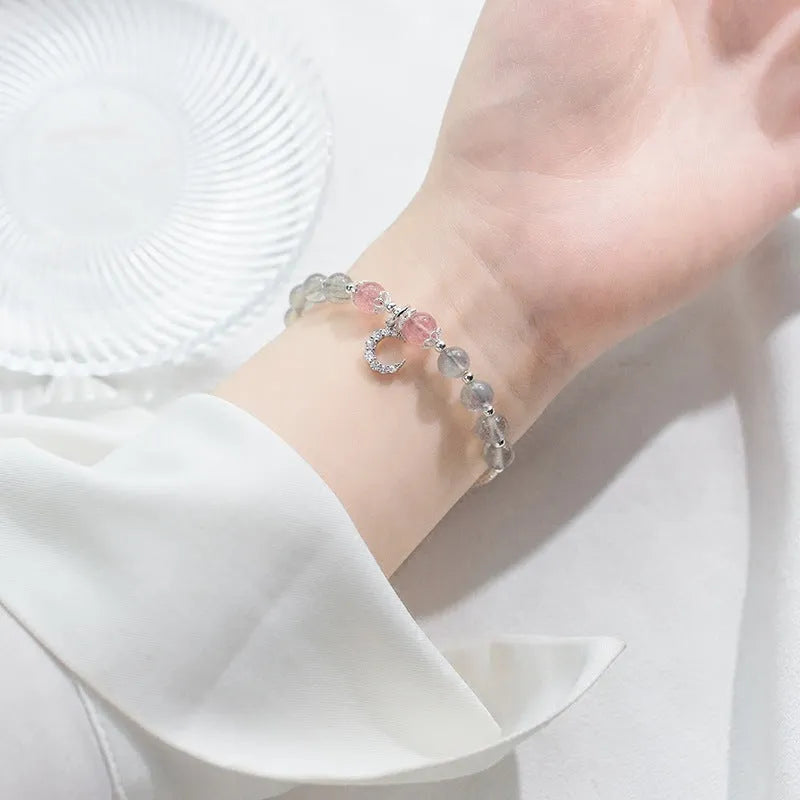 Handmade adjustable moonstone bracelet with 6mm stone and crescent moon charm on silver chain