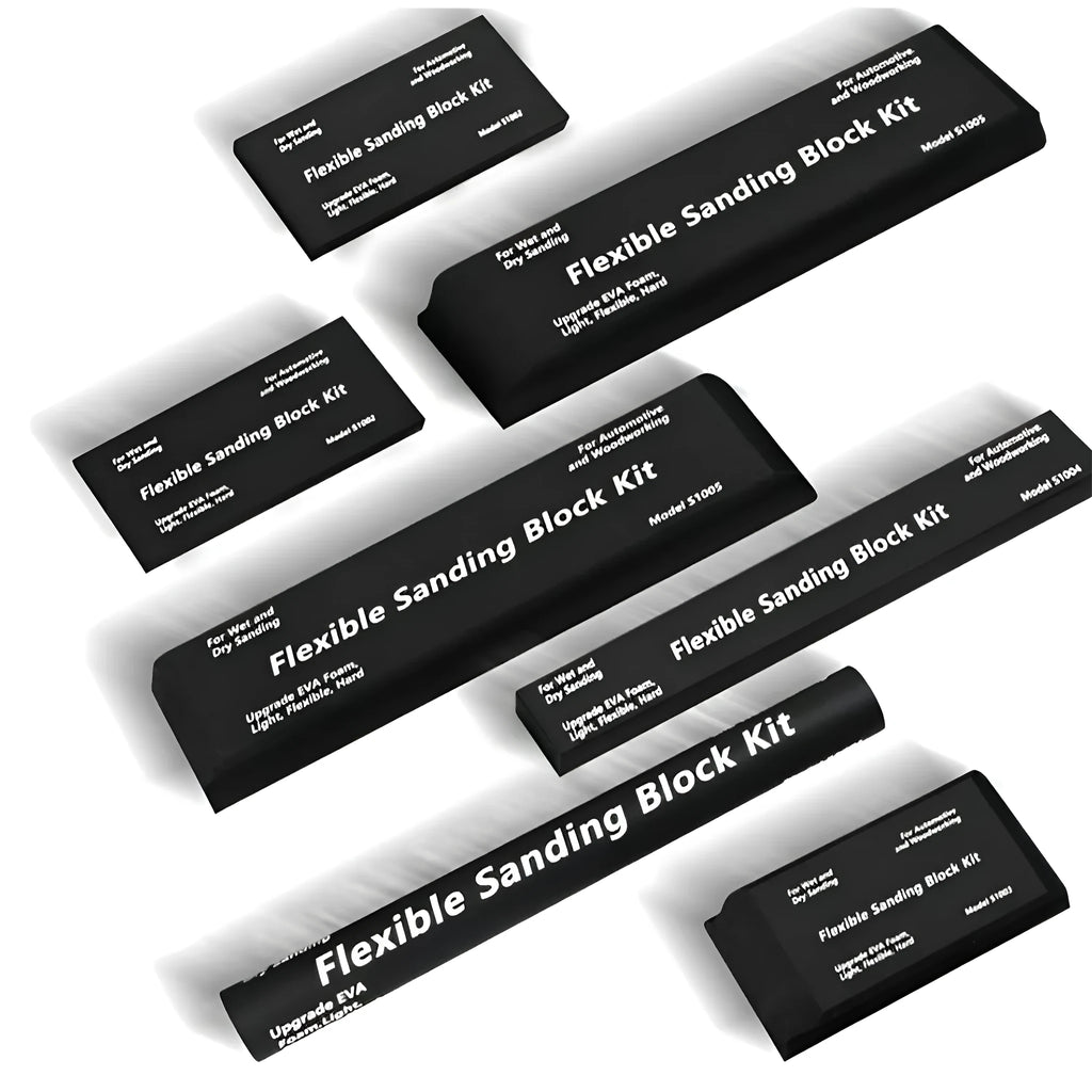 Seven black frosted metal building blocks arranged for architectural model assembly