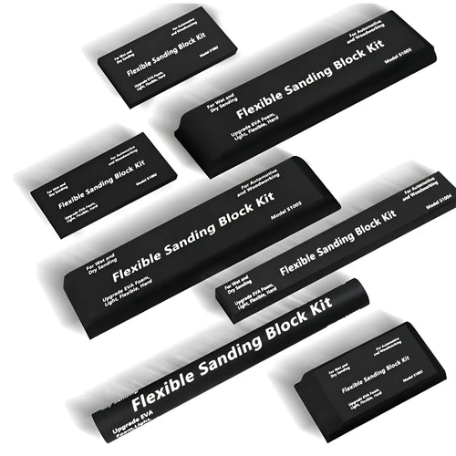 Seven black frosted metal building blocks arranged for architectural model assembly