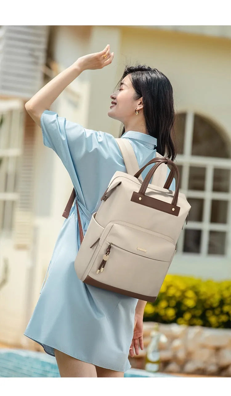 Large women's backpack in apricot colour with adjustable shoulder straps showing dimensions