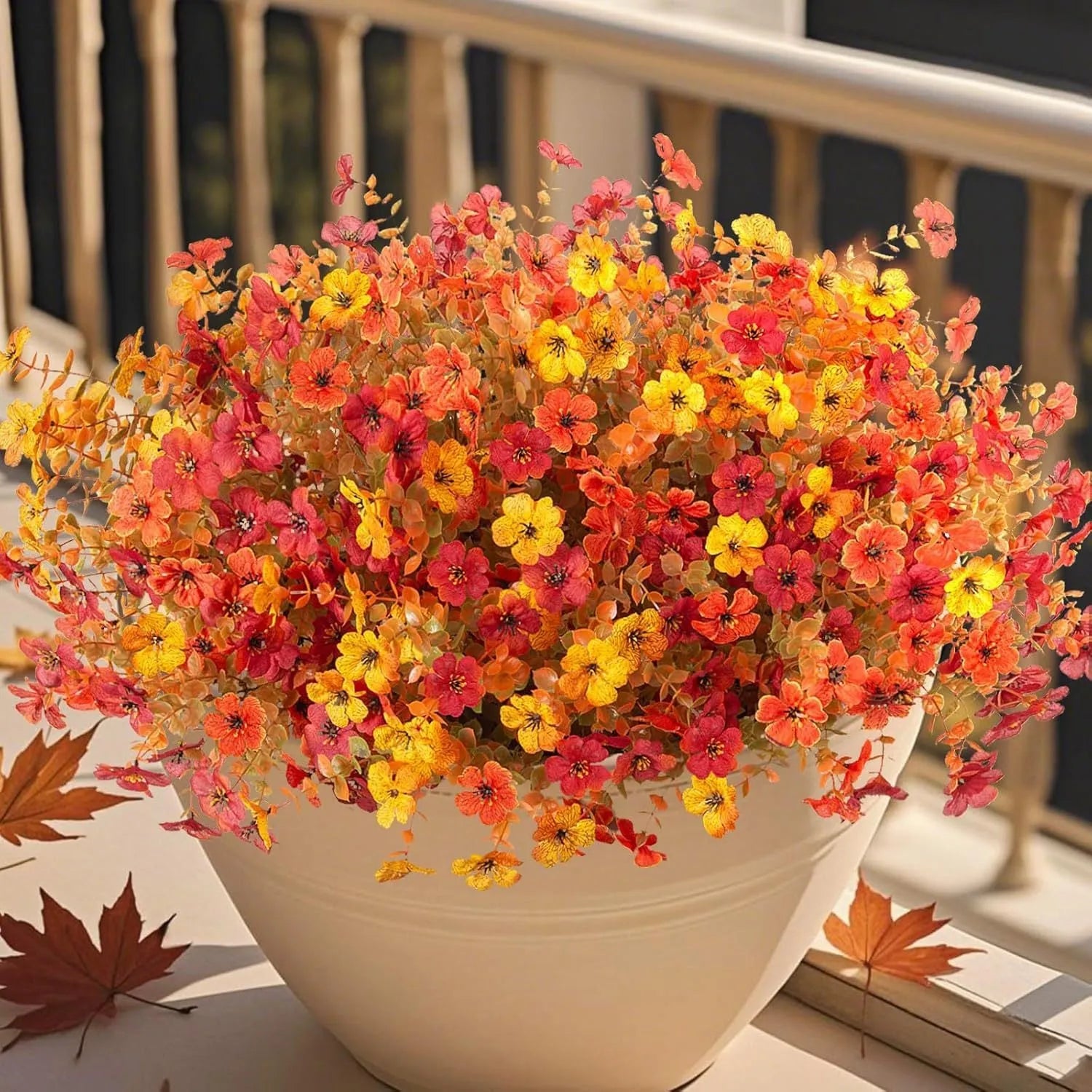 Artificial flower bouquet with autumn orange, red, and yellow silk flowers on plastic stems for decoration
