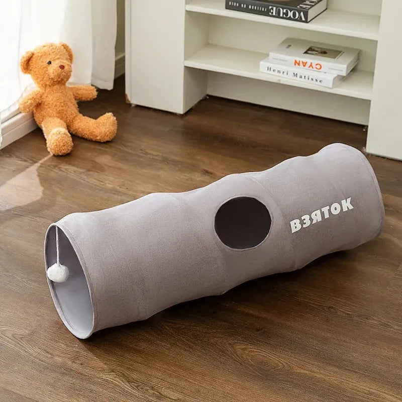 Collapsible cat tunnel with plush ball in brown or grey, showing foldable steel wire frame and suede fabric