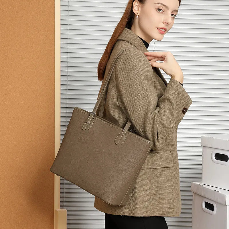 Genuine leather retro women's tote bag in horizontal square shape, showing internal zipper and phone pockets.