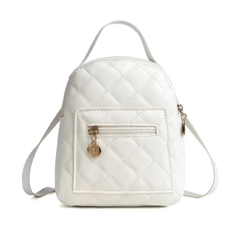 Girls' hard structured backpack with embroidery in white, black, or pink colours, showing front view and soft handle.