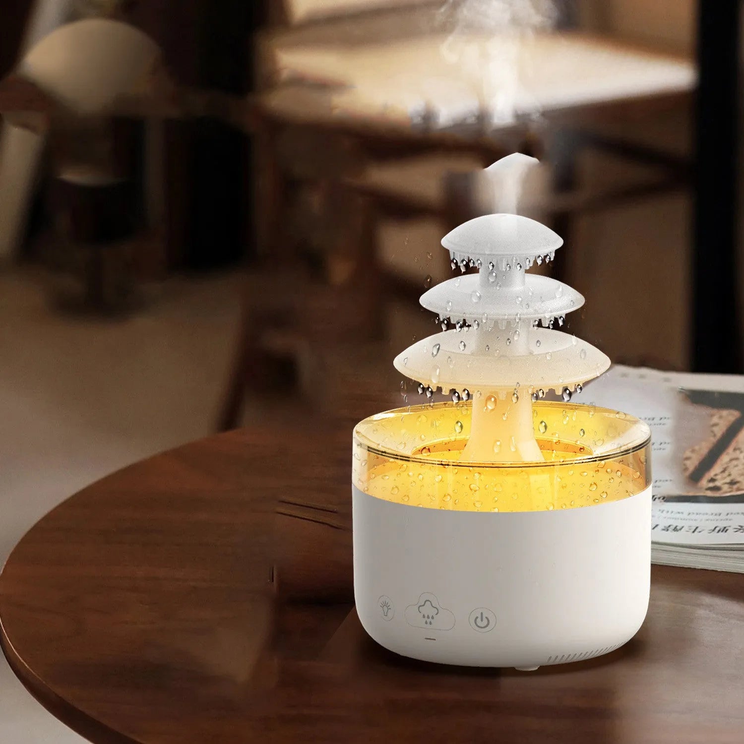 White cloud rain ultrasonic humidifier and essential oil diffuser with colourful LED lights on desk