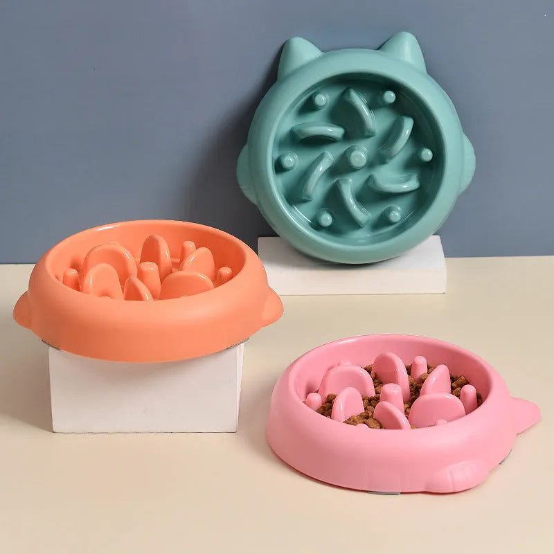 Green bone-shaped slow feeder dog bowl with internal ridges for anti-gulping.