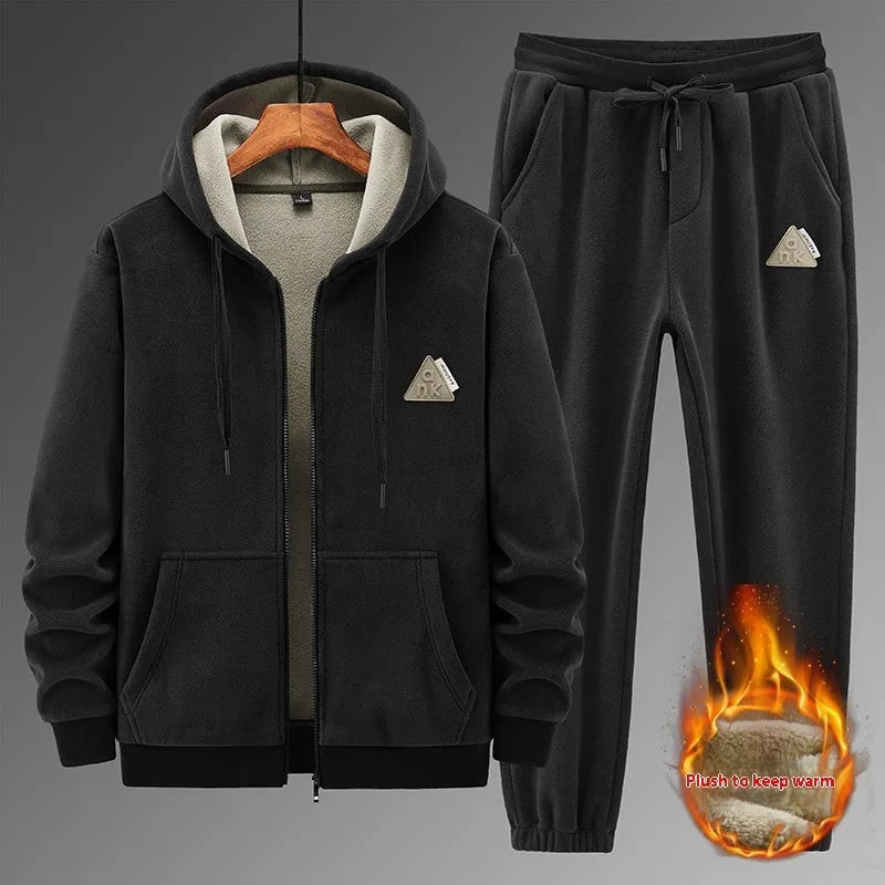 Grey men's hooded sports suit with long sleeves and full-length trousers on a neutral background.