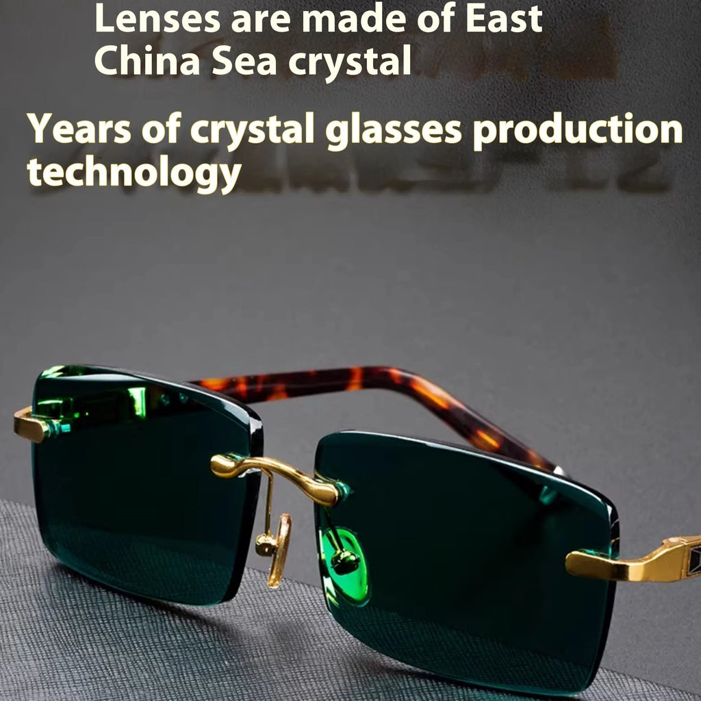 Dark green tinted frameless sunglasses with crystal lenses, shown with a hard protective case and cleaning cloth.