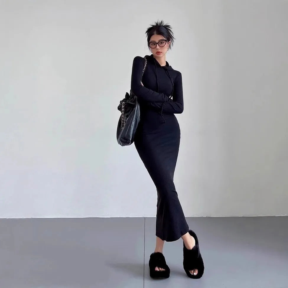 Women's light gray hooded sheath dress with long sleeves and a high waist on a hanger
