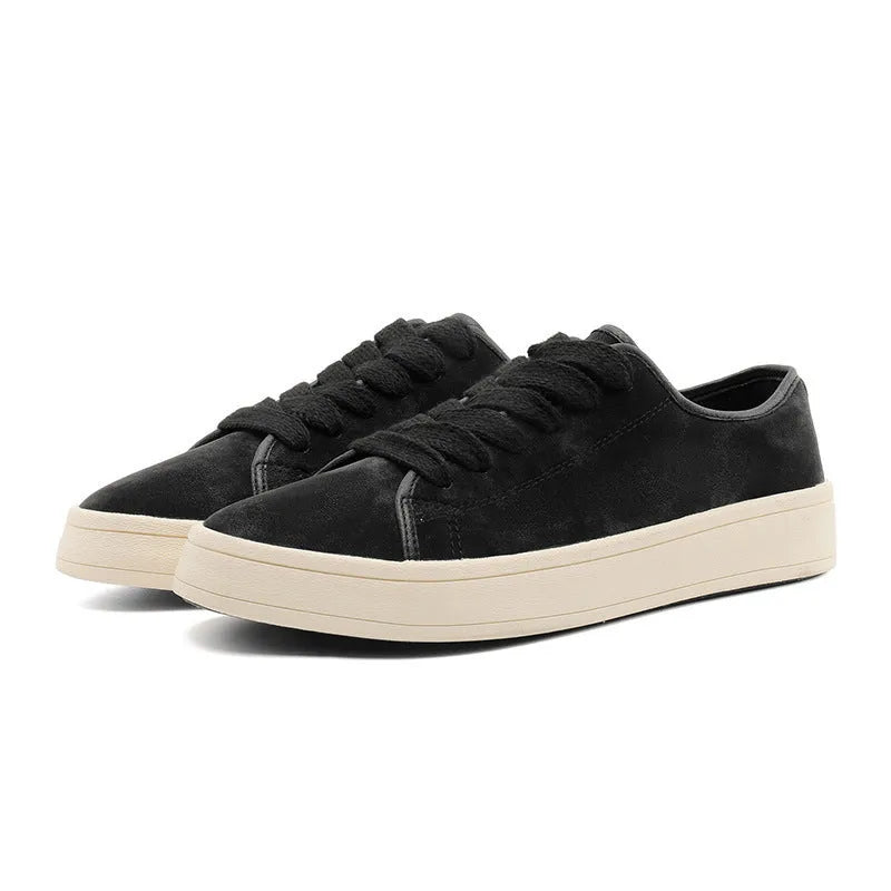 Breathable matte leather sports casual shoes in black with stitched detailing, low-top profile, and rubber sole