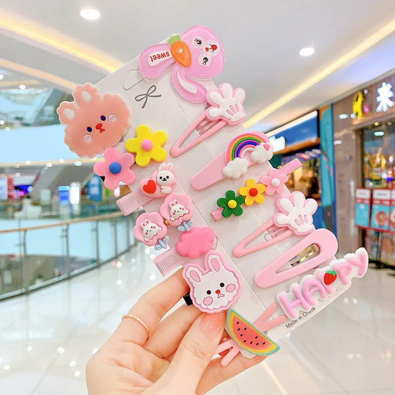 14-piece toddler hair clips set with rainbow barrettes, candy fruit, butterfly, and ice cream patterns on white background