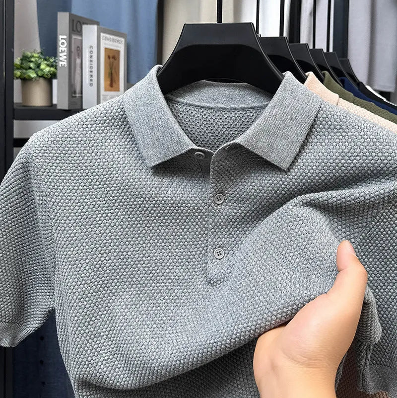 Men's loose grey short sleeve cotton sweater on a hanger