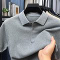 Men's loose grey short sleeve cotton sweater on a hanger