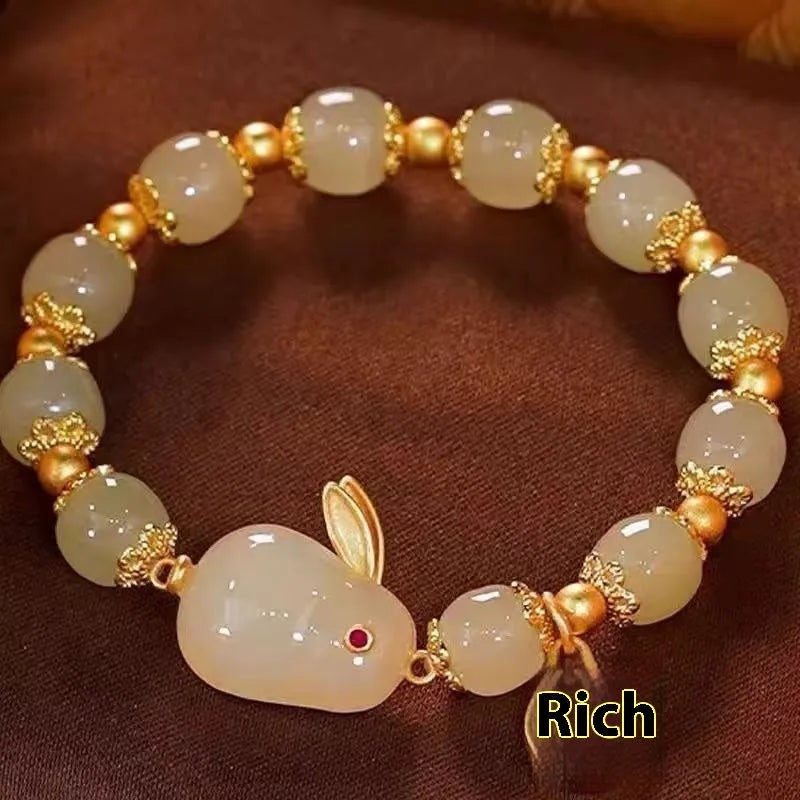 Green electroplated Jade Hare bracelet for women with Chinese style zodiac design and lily elements