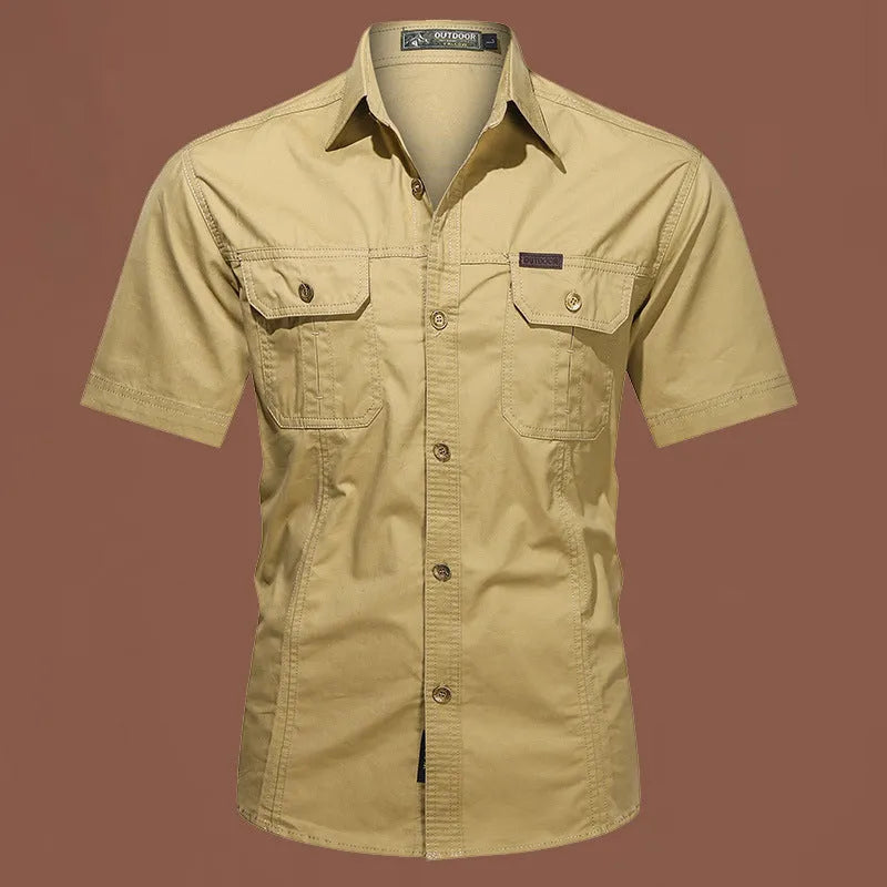 Men's army green short sleeve cotton work shirt with a loose cardigan fit on a hanger.