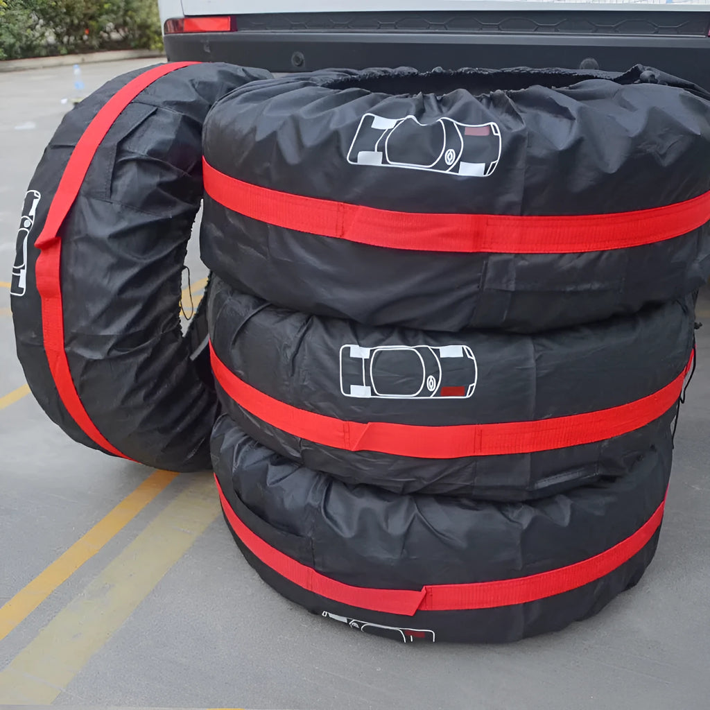 Four black Oxford cloth polyester tyre protective covers laid flat, showing their circular shape.