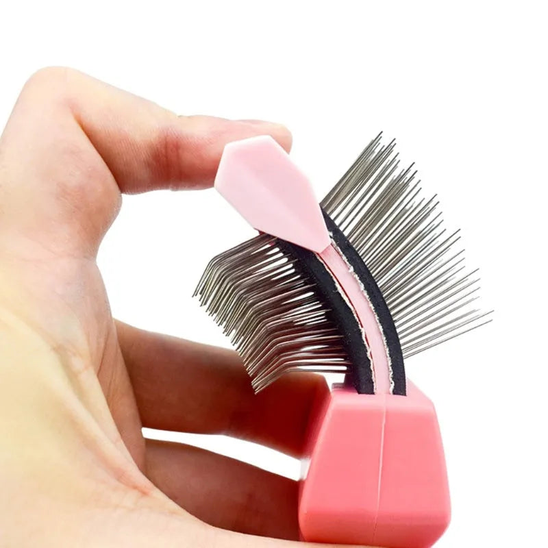 Double-sided stainless steel pet brush for dogs and cats in blue or pink with ergonomic handle