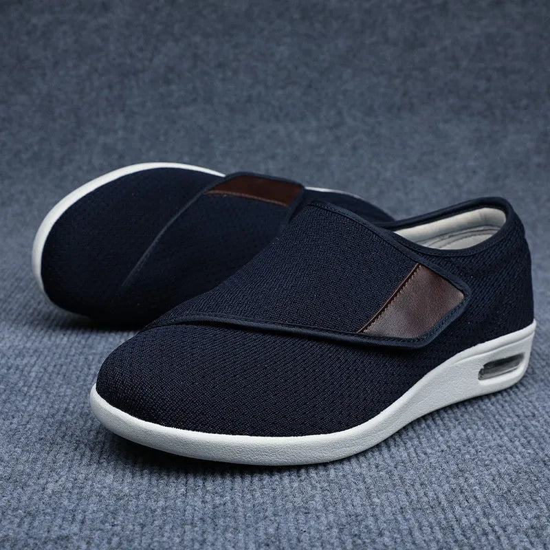 Beige leisure shoes with a velcro strap, textile and synthetic leather upper, and a rubber sole.