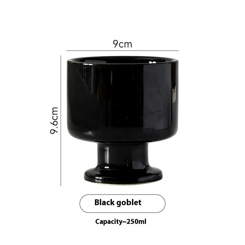 Hand-pinched irregular shaped ceramic mug in a solid colour on a plain background.