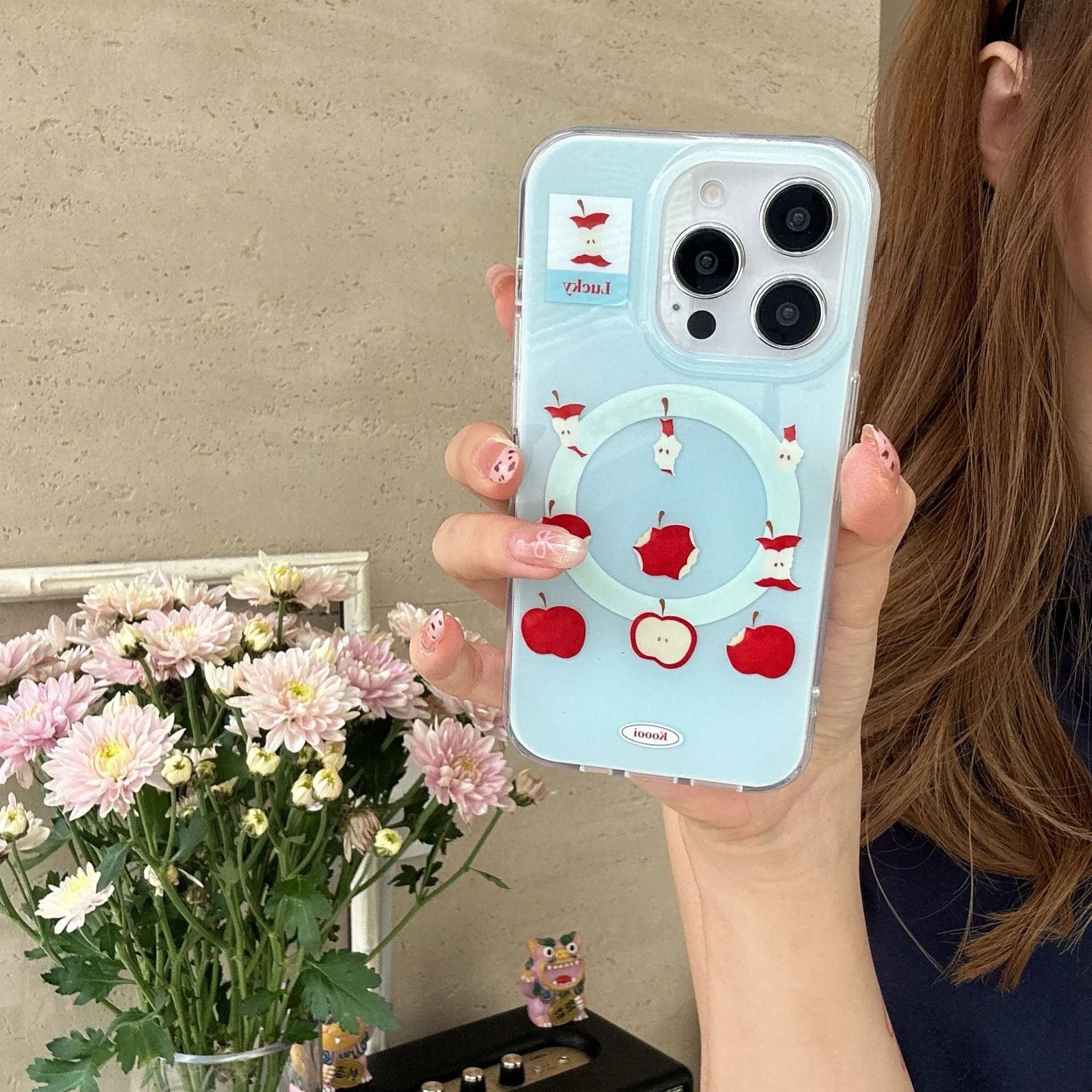 Magnetic phone case with blue bottom for Apple iPhone showing embossed finish and side view