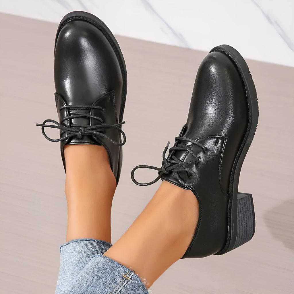 Black women's professional work shoes with chunky heel and low top design