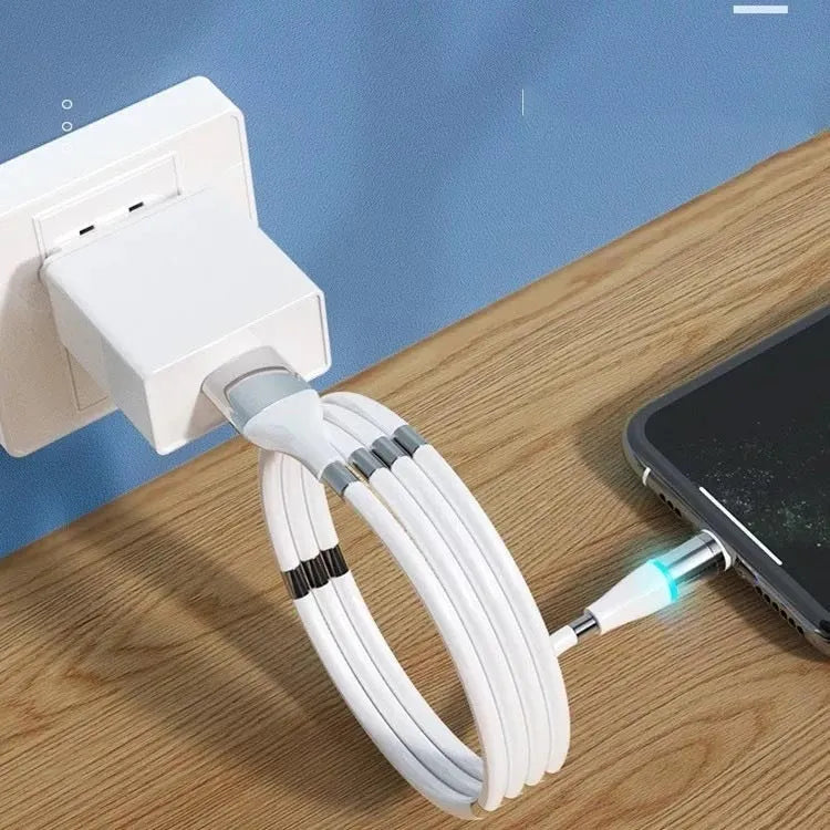 White silicone three-in-one data cable with Android, Apple, and Type-C heads on a surface