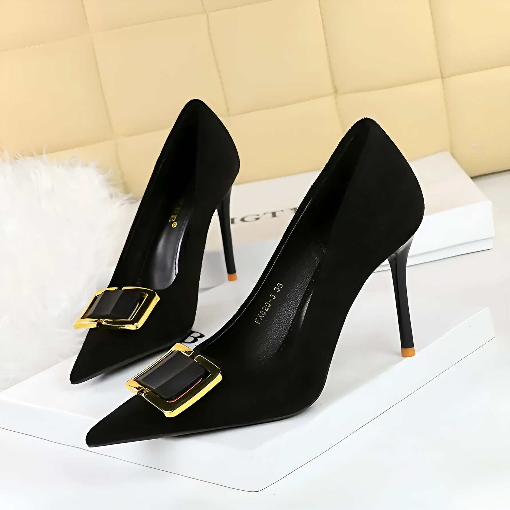 Black suede women's high heel court shoes with a 9cm stiletto heel and pointed toe on a rubber sole.