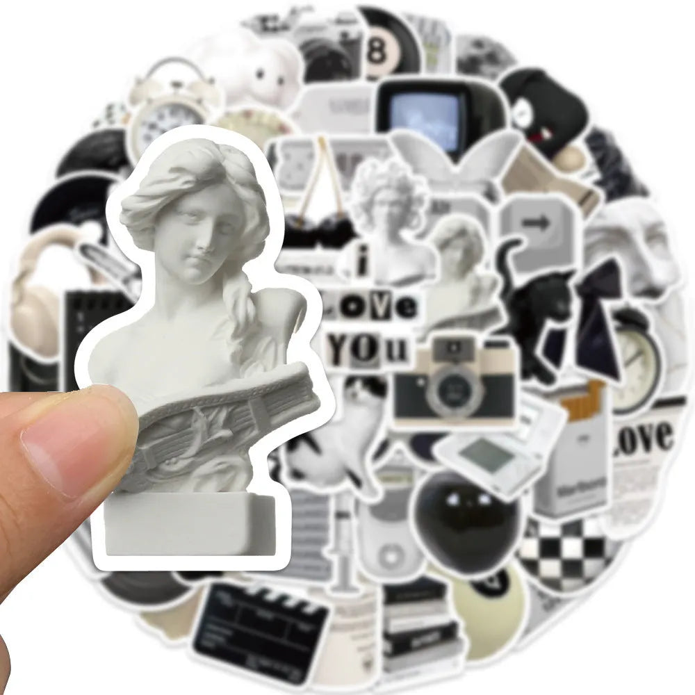 61 black and white waterproof PVC stickers for laptops, phones, and luggage decor.