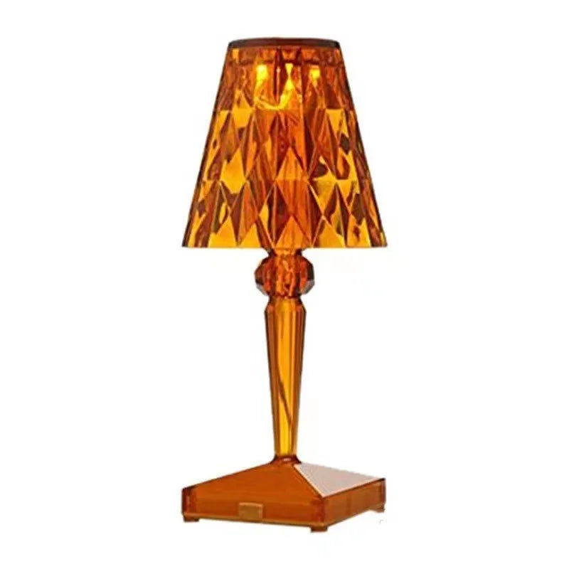 Rose gold portable touch control night light with rechargeable battery on a surface