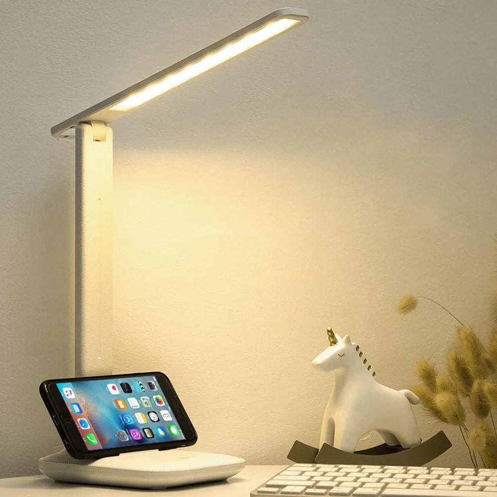 White plastic children's bedside lamp with touch dimming controls and USB charging port