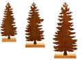 Set of three rustic iron metal Christmas tree and elk silhouette ornaments on a wooden surface.