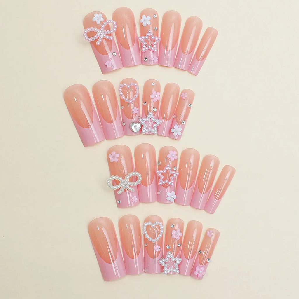 Wearable false nails with love pattern and French spot drill bows in XB-70-48 colour on a plastic armour suit.