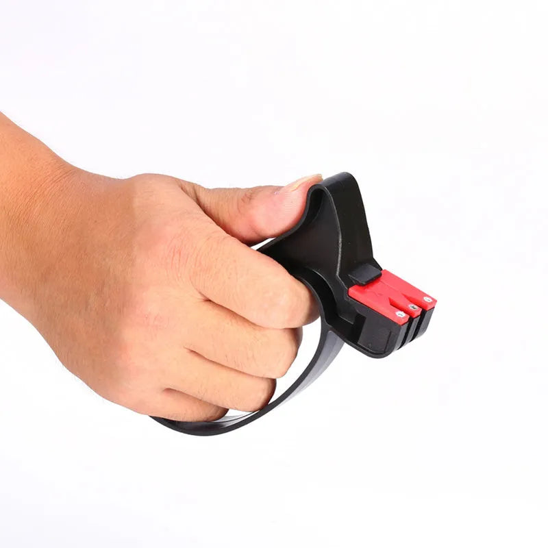 Handheld 2-in-1 black knife and scissor sharpener with tungsten steel blade on white background