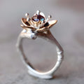 Silver two-tone floral geometric women's fashion ring made from alloy.