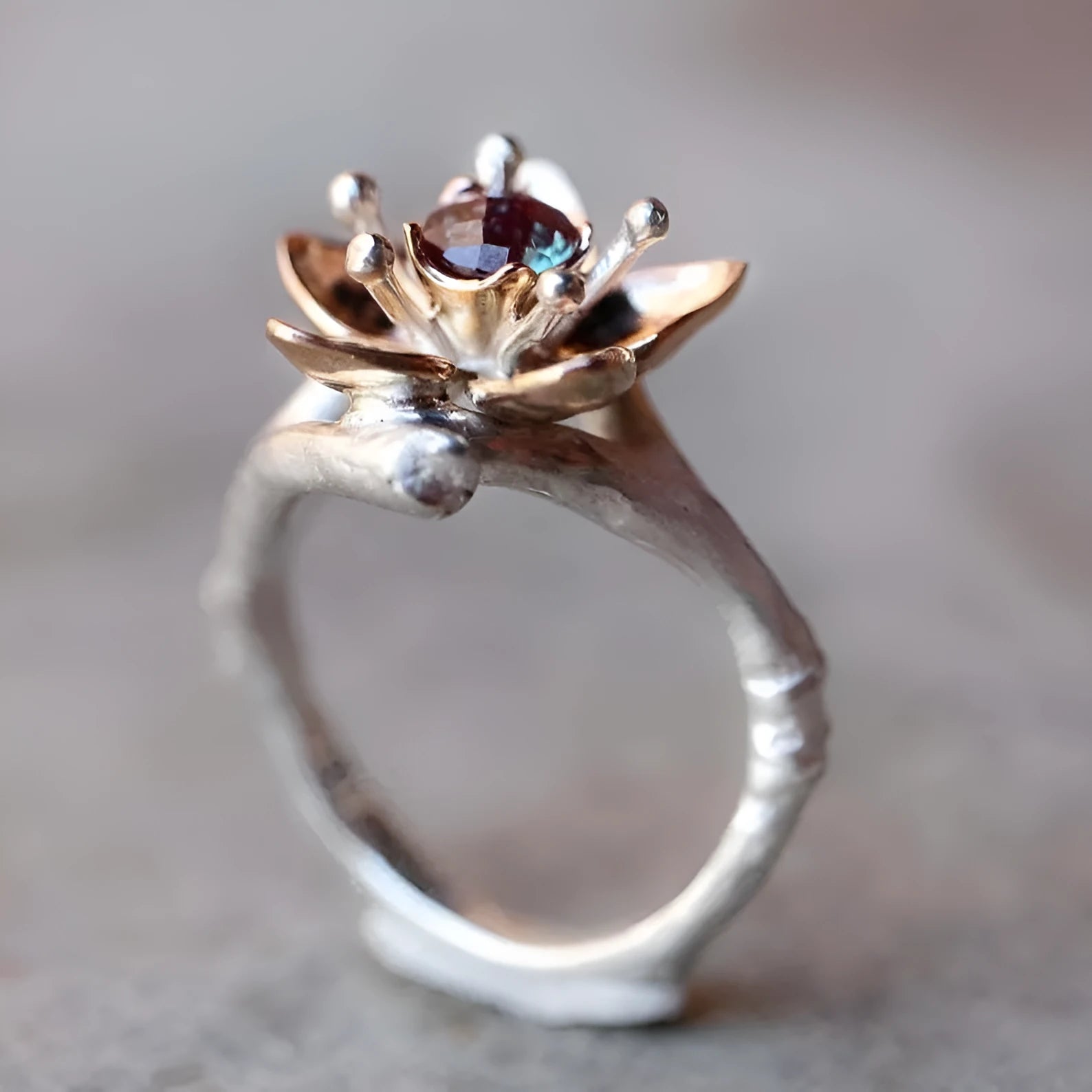 Silver two-tone floral geometric women's fashion ring made from alloy.