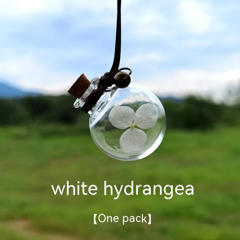Glass car perfume pendant with preserved flowers for interior decoration and air freshening