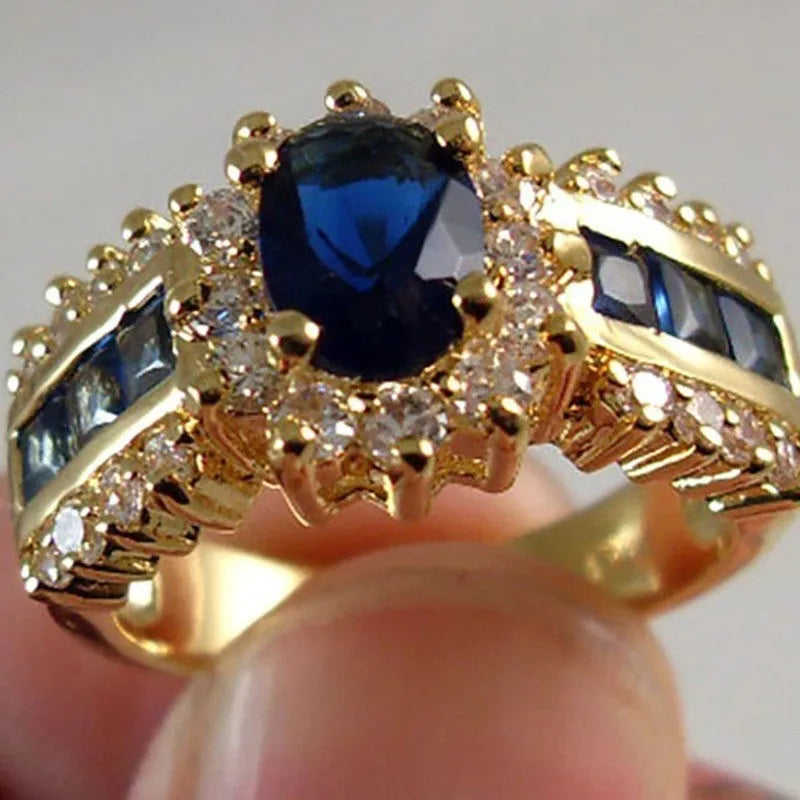 Personalised fashion rings with diamond treatments in blue and purple designs on zinc alloy