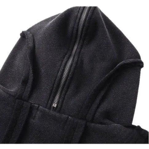 Man wearing a black retro-style zip-front cotton hooded coat with abstract pattern.