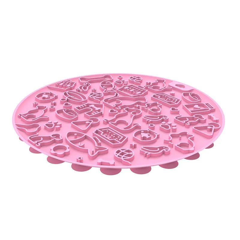 Round blue silicone pet licking mat with sucker base on a floor.