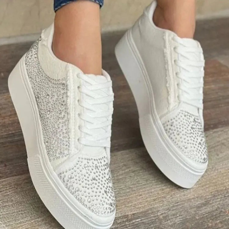 Women's plus size black casual sports shoes with rhinestones on the upper and a flat rubber sole.