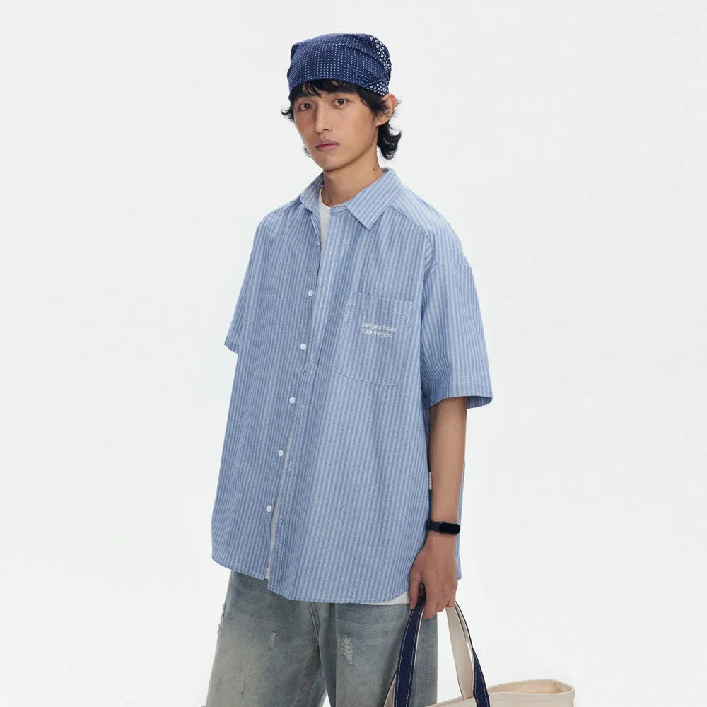 Blue striped overalls shirt for men and women in loose fit cardigan style with short sleeves