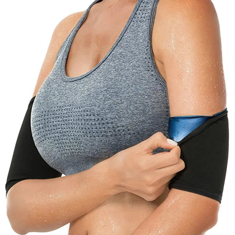 Adjustable arm sweatband in blue on a gym background, showing the binding strap.