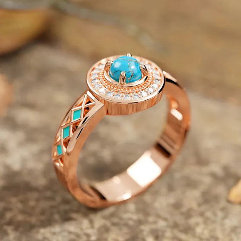 Rose gold copper women's ring with turquoise geometric design and micro inlaid zircon stones.