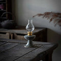 Retro split design black antique handmade kerosene lamp with underglaze finish on a shelf